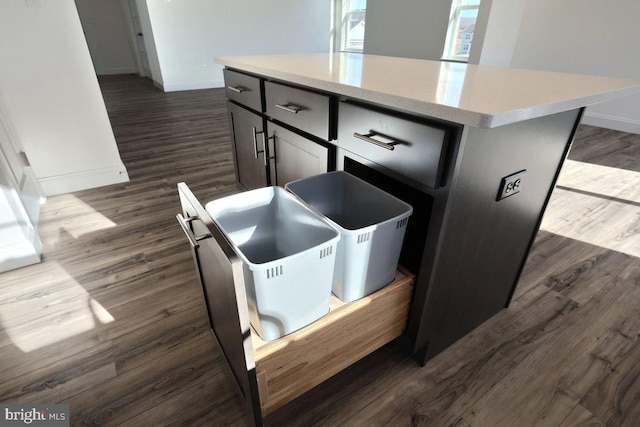 interior space with dark hardwood / wood-style floors and a kitchen island