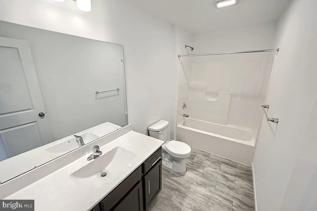 full bathroom with vanity, bathing tub / shower combination, and toilet