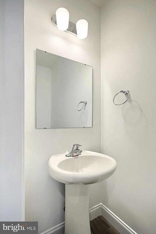 bathroom with wood-type flooring