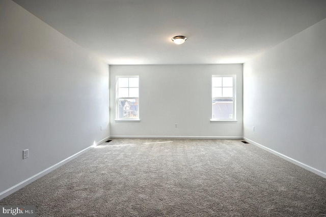 empty room with carpet flooring