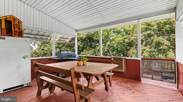 sunroom / solarium featuring a healthy amount of sunlight