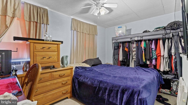 bedroom with ceiling fan and light carpet