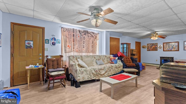 living room featuring ceiling fan and light wood-type flooring