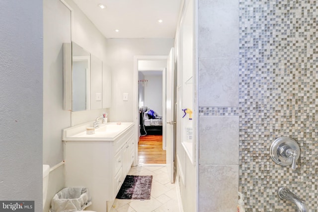 bathroom with vanity and hardwood / wood-style flooring