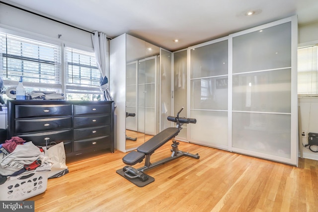 exercise room featuring light hardwood / wood-style flooring