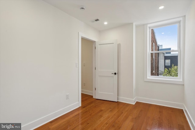 spare room with visible vents, recessed lighting, light wood-style floors, and baseboards