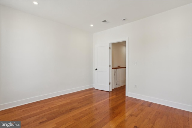 empty room with recessed lighting, visible vents, baseboards, and light wood-style flooring