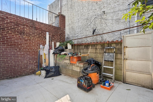 view of patio featuring fence