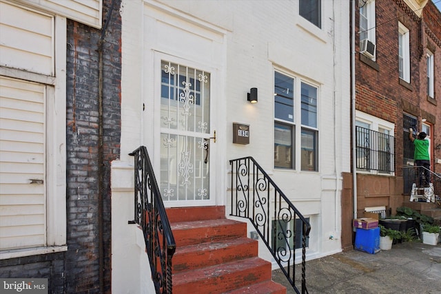 property entrance with brick siding