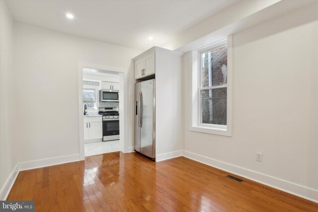 basement featuring hardwood / wood-style floors