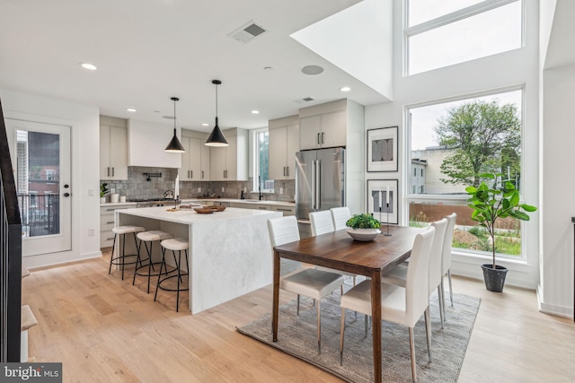 dining space with light wood-type flooring