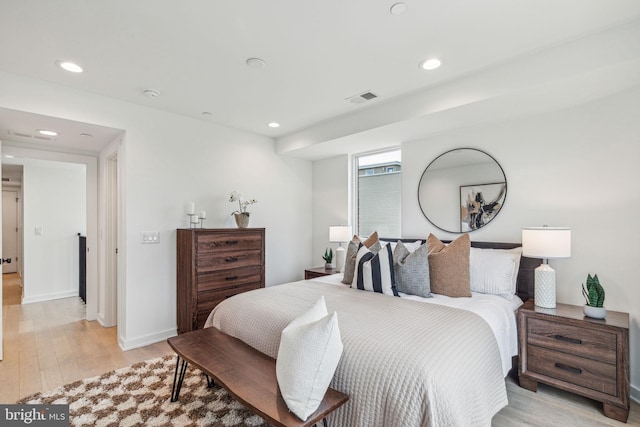 bedroom with light hardwood / wood-style flooring