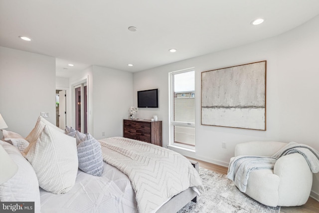 bedroom with light hardwood / wood-style flooring