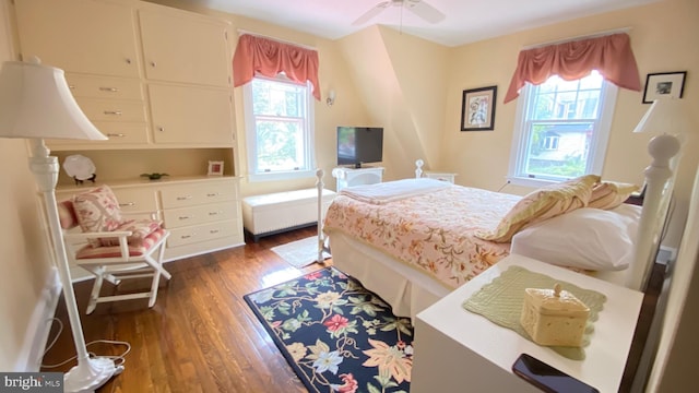 bedroom featuring ceiling fan and dark hardwood / wood-style flooring