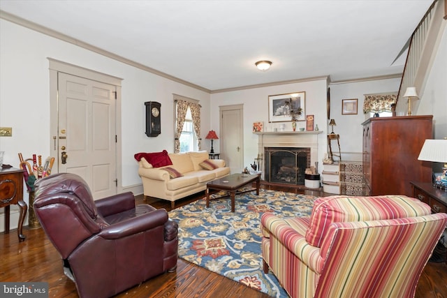 living room with ornamental molding and dark wood-type flooring