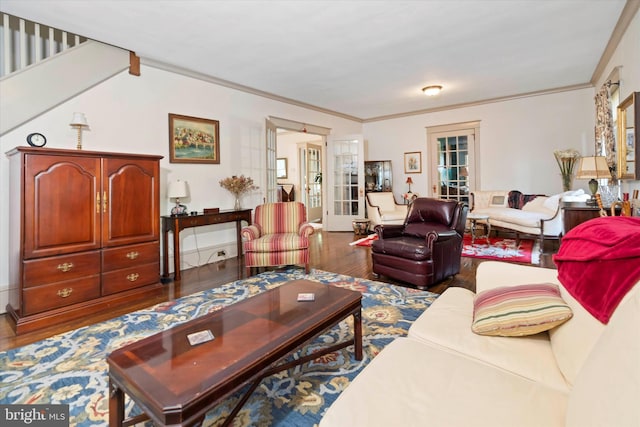 living room featuring french doors, wood-type flooring, and ornamental molding