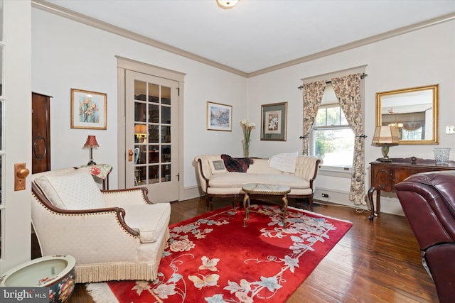 living room with dark hardwood / wood-style floors and ornamental molding