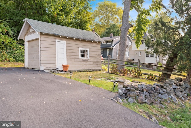 view of front of house with an outbuilding