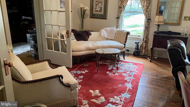 sitting room with wood-type flooring