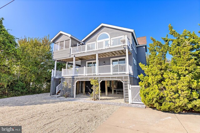 rear view of property with a balcony