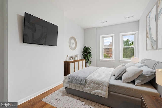 bedroom with hardwood / wood-style flooring