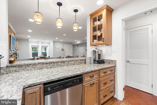 kitchen with pendant lighting, light tile patterned floors, stainless steel dishwasher, and light stone countertops