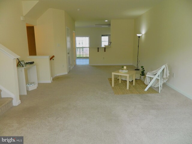 unfurnished room with light carpet