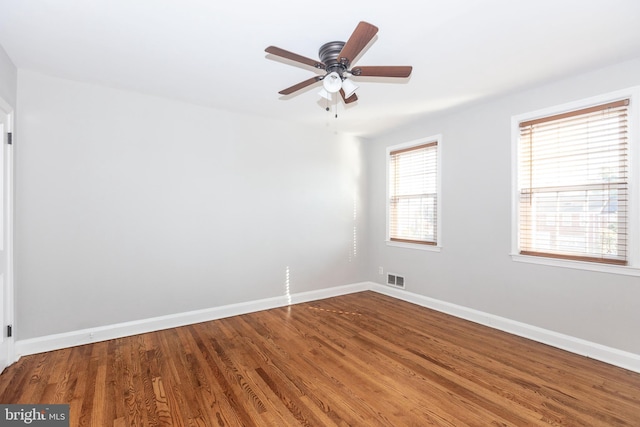 unfurnished room featuring ceiling fan and hardwood / wood-style flooring