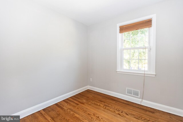 spare room featuring hardwood / wood-style flooring