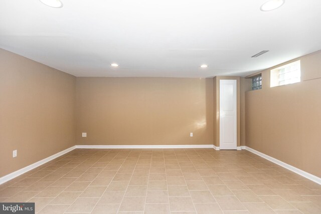 basement with light tile patterned floors