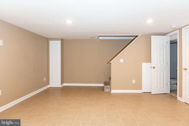 basement with light tile patterned floors