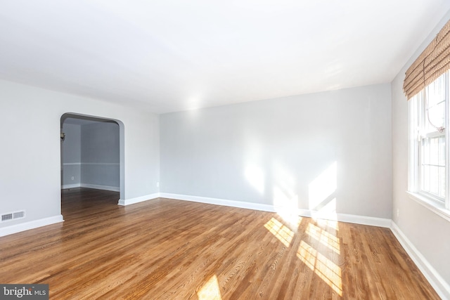 empty room featuring wood-type flooring