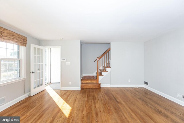 interior space with light hardwood / wood-style floors and french doors