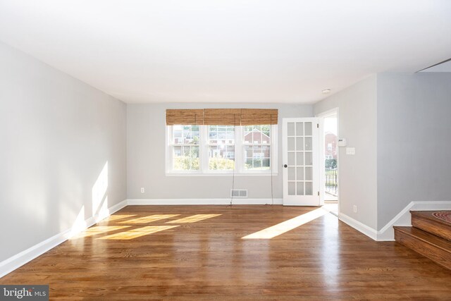 unfurnished room featuring wood-type flooring