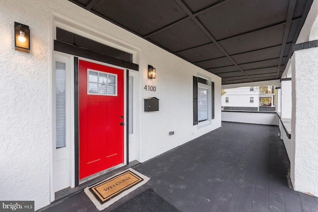 doorway to property with a porch