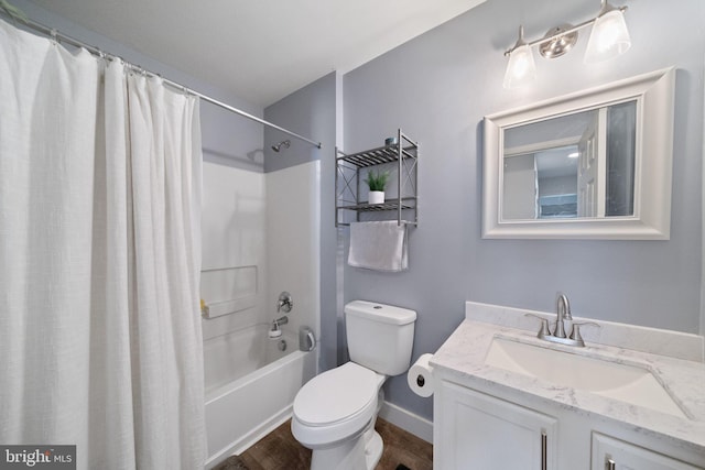 bathroom featuring wood finished floors, shower / bathtub combination with curtain, toilet, and vanity