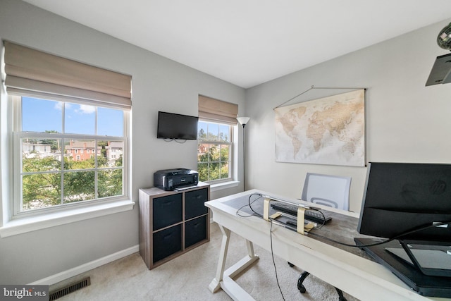 office with light carpet, baseboards, and visible vents