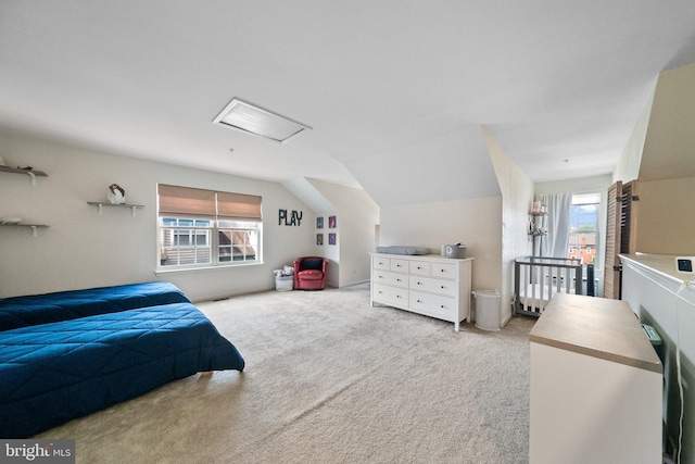 bedroom with lofted ceiling and carpet floors