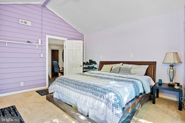 bedroom featuring wood walls, carpet flooring, and vaulted ceiling with beams