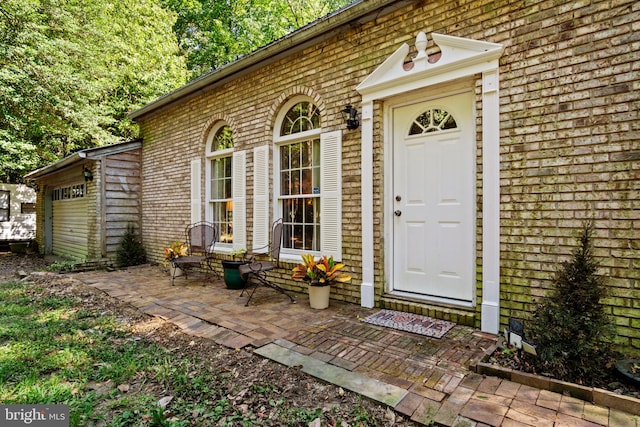 entrance to property with a patio area