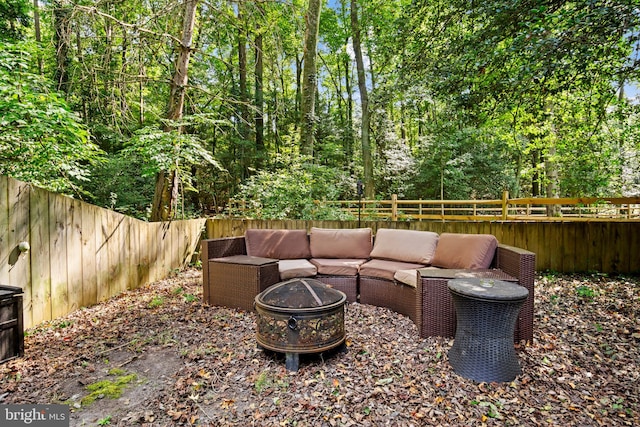 view of patio / terrace with an outdoor living space with a fire pit