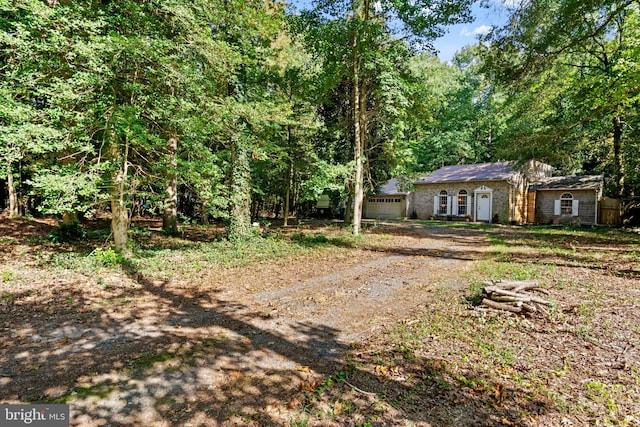 view of yard with a garage