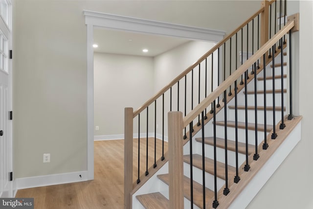 stairway featuring hardwood / wood-style floors