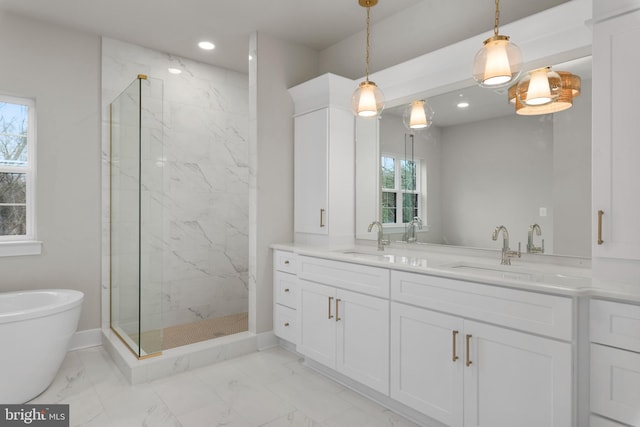 bathroom featuring vanity and separate shower and tub