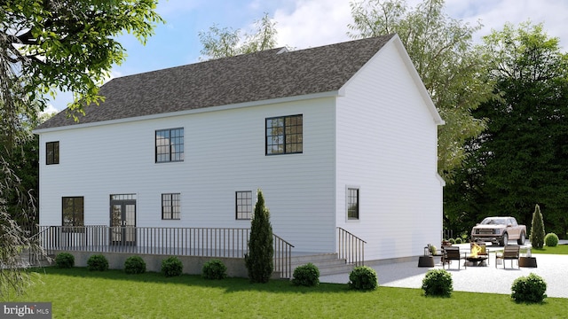 rear view of property featuring a patio area, a lawn, and roof with shingles