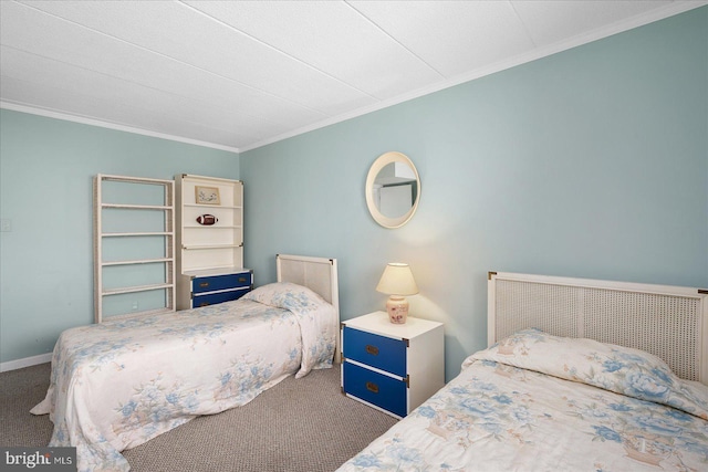 bedroom with ornamental molding, baseboards, and carpet floors