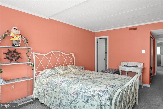 carpeted bedroom with visible vents and crown molding