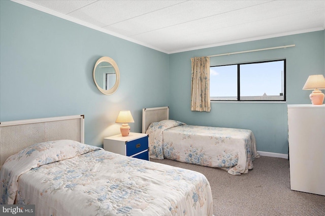 carpeted bedroom with baseboards and ornamental molding