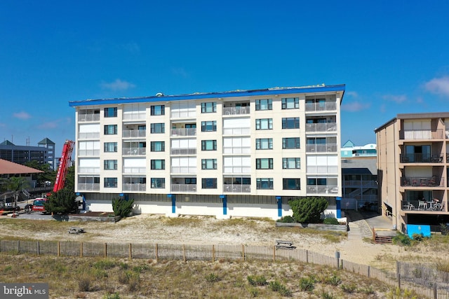 view of property with fence