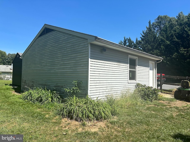 view of home's exterior with a lawn